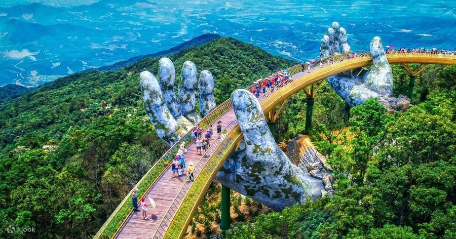 The Golden Bridge at Ba Na Hills, held up by two giant stone hands above the forest