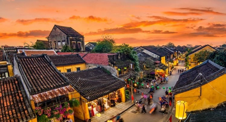 The yellow shophouses and river of Hoi An Ancient Town at sunset