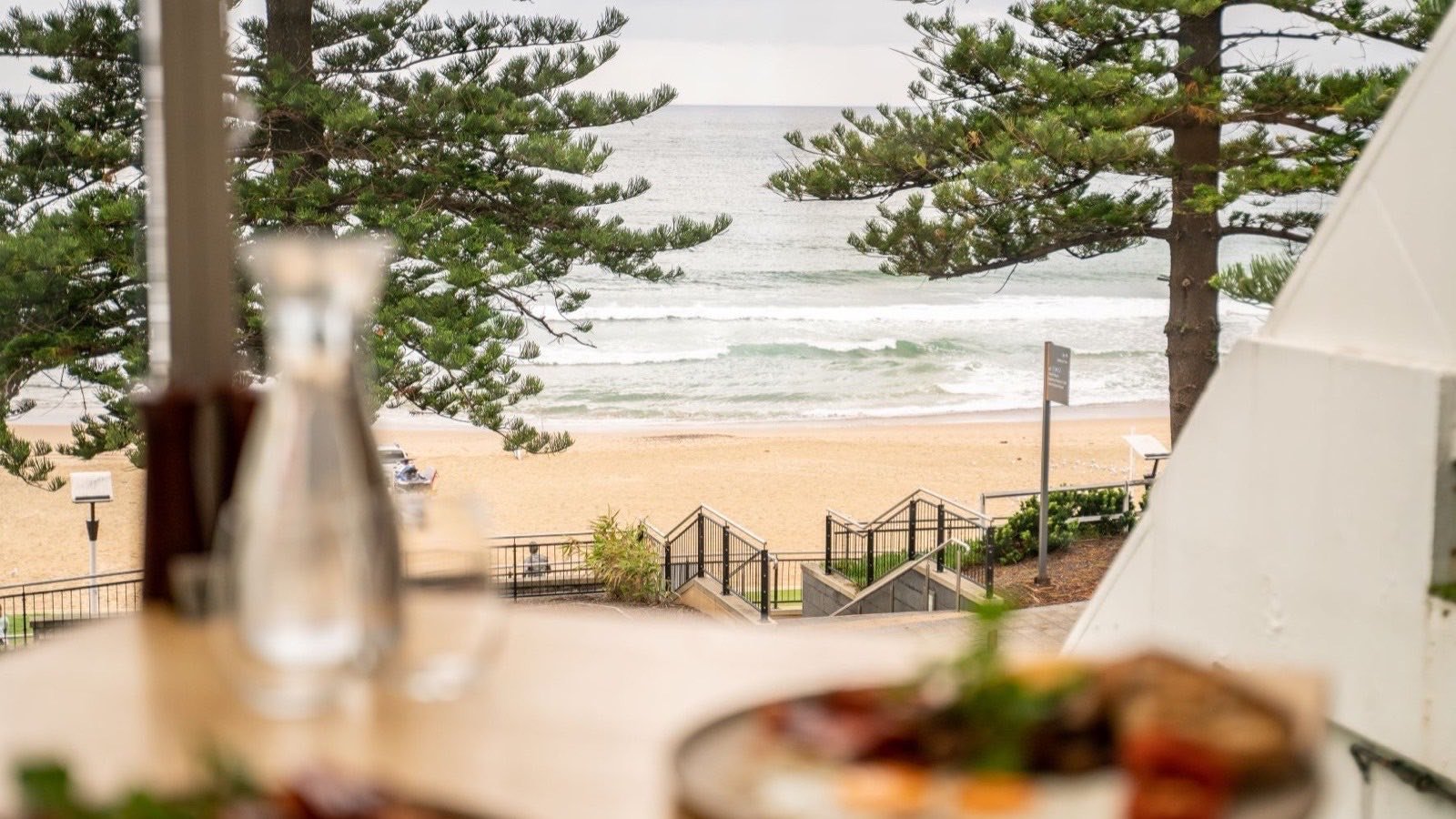 North Wollongong Beach and the Pacific seen through the Norfolk pines from the Novotel